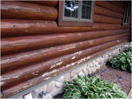 Finish pealing on a log home.