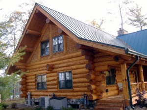 A freshly blasted and stained log home.
