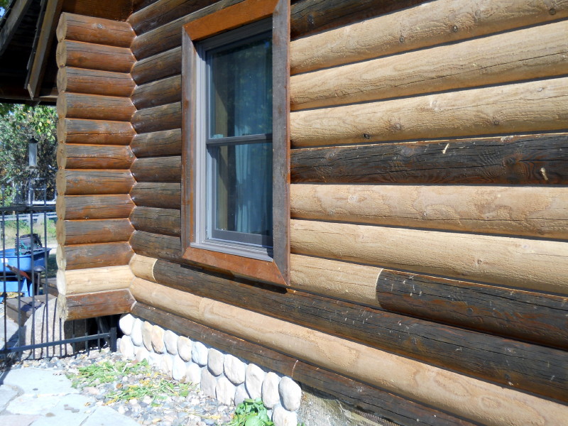 A wood home that has had replacement logs installed.