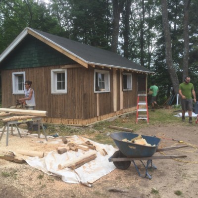 small vertical log cabin