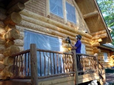 Applying borate treatment to log home