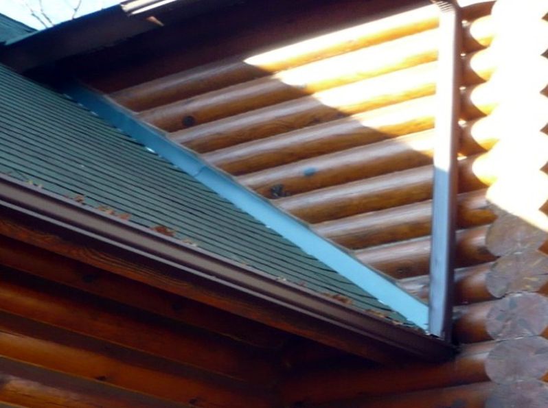 Restored log walls and roof flashing